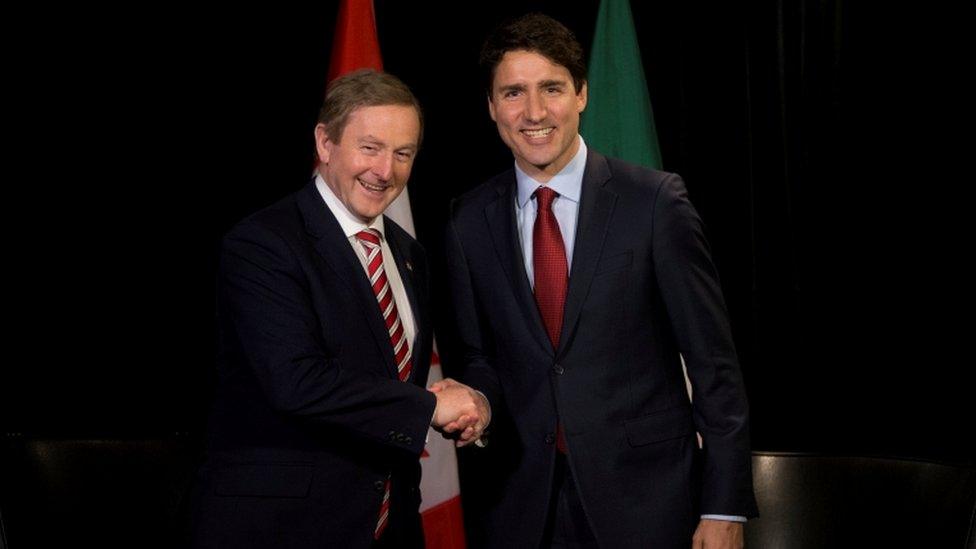 Enda Kenny shakes hands with Justin Trudeau during a visit to Montreal in May 2017