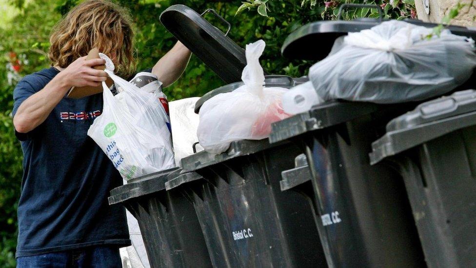 Man sorts rubbish