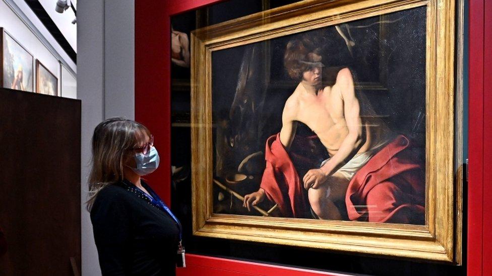 Caravaggio's San Giovanni Batista artwork on exhibit a the Royal Museums of Turin, Italy