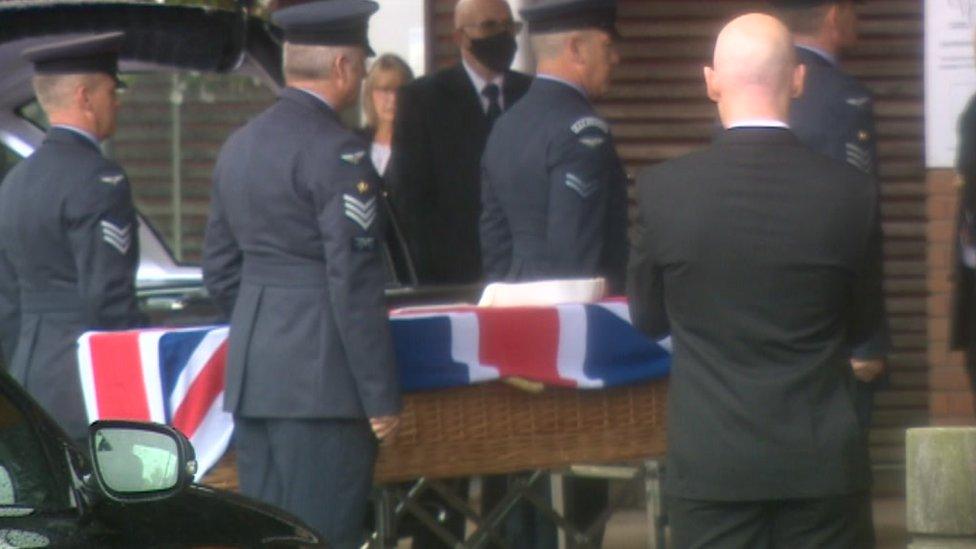 The coffin entering the crematorium