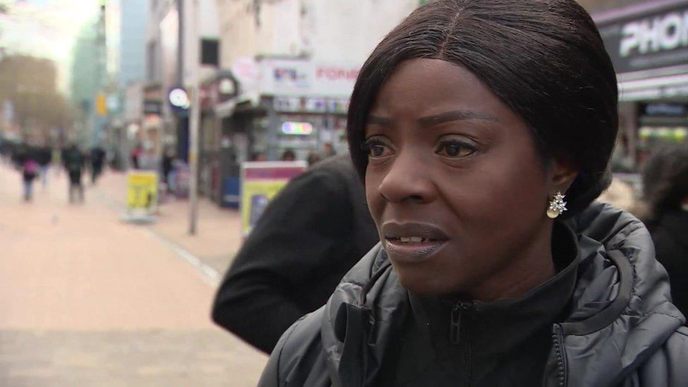 A woman standing in Croydon