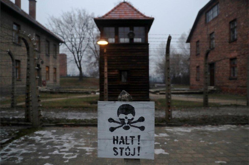 A sign reading "Stop!" in German and Polish is seen at the former Nazi German concentration and extermination camp Auschwitz, 27 January 2018