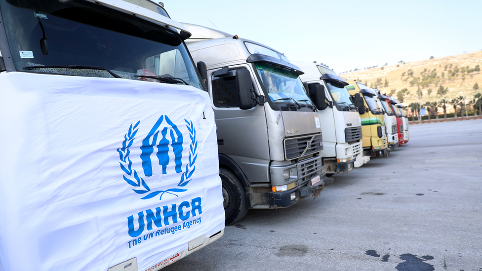 Trucks carrying aid into Syria