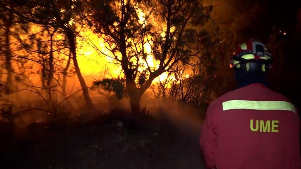 Grab from a video released on 27 June of firefighters tackling the Catalonia fire