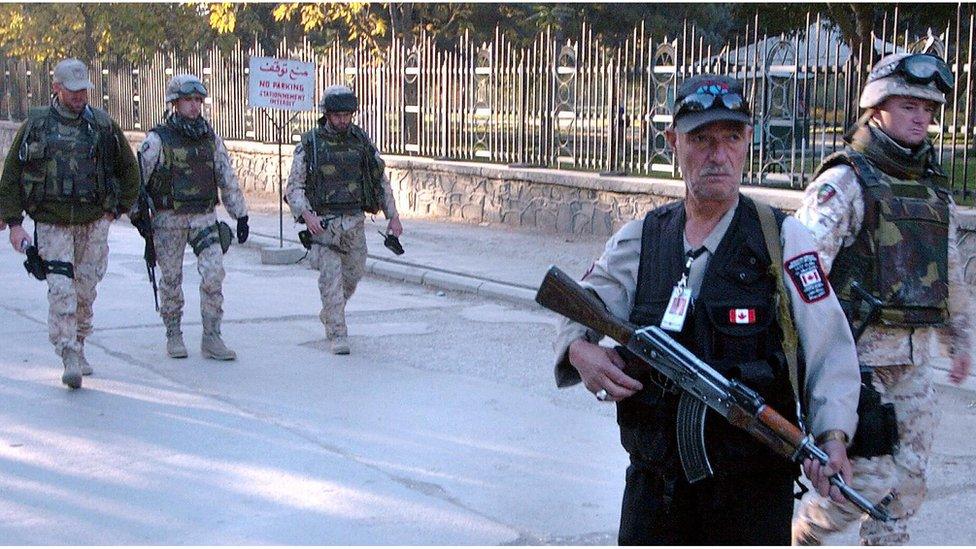 Soldiers and a security guard outside the Canadian embassy, Kabul, in 2005