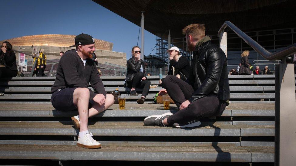 People sat on the steps of the Senedd