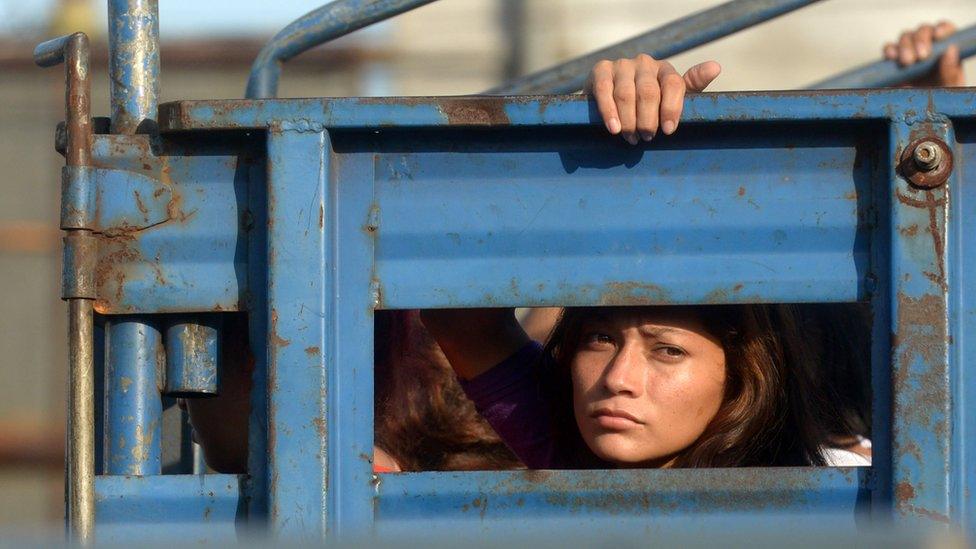 Alleged members or associates of the Mara Salvatrucha (MS-13) in the back of a truck