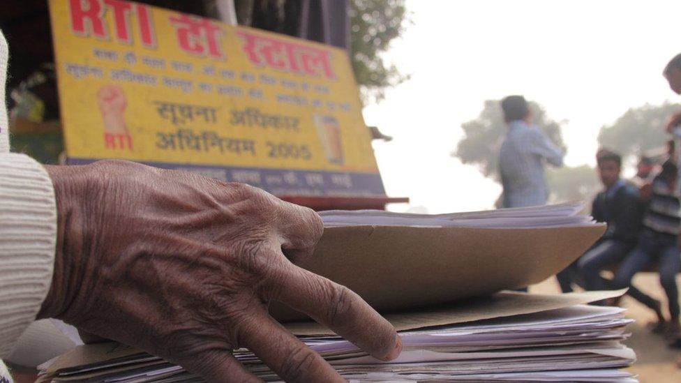 Mr Yadav speaking to villagers about RTI