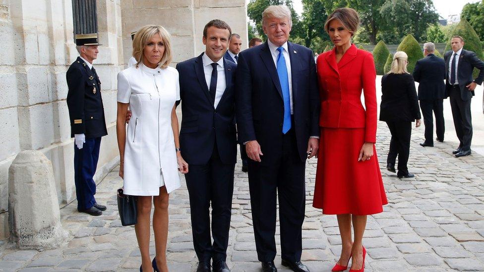 French President Emmanuel Macron (2L) poses next to his wife Brigitte Macron (L), US President Donald Trump and US First Lady Melania Trump outside the Army Museum