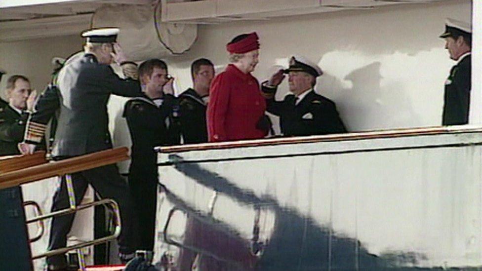 The Queen and Duke of Edinburgh are piped aboard Britannia for the last time