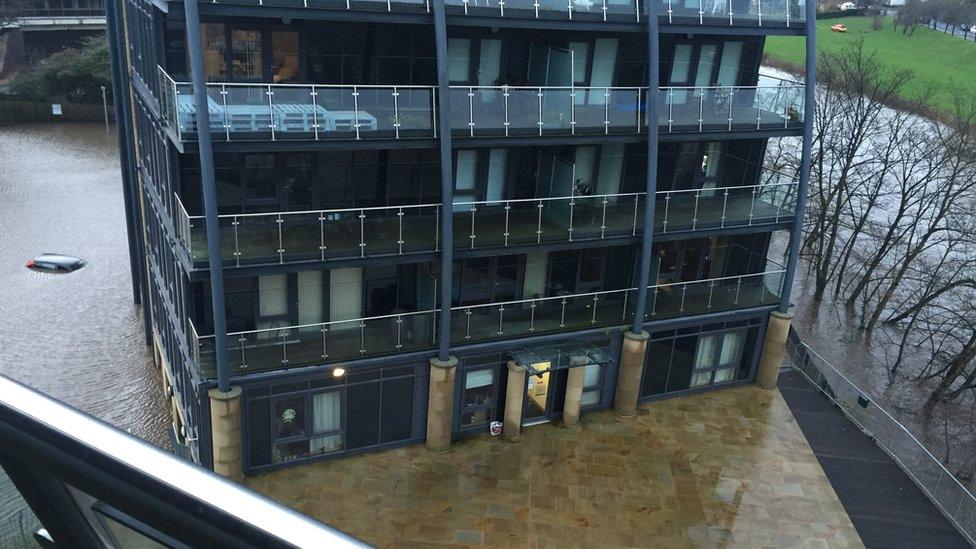 View from a block of flats which is surrounded by water in Shipley