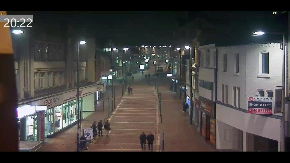 Tom Webb, in between two friends, outside Tesco Express on St Peter's Street in Derby on the night he died