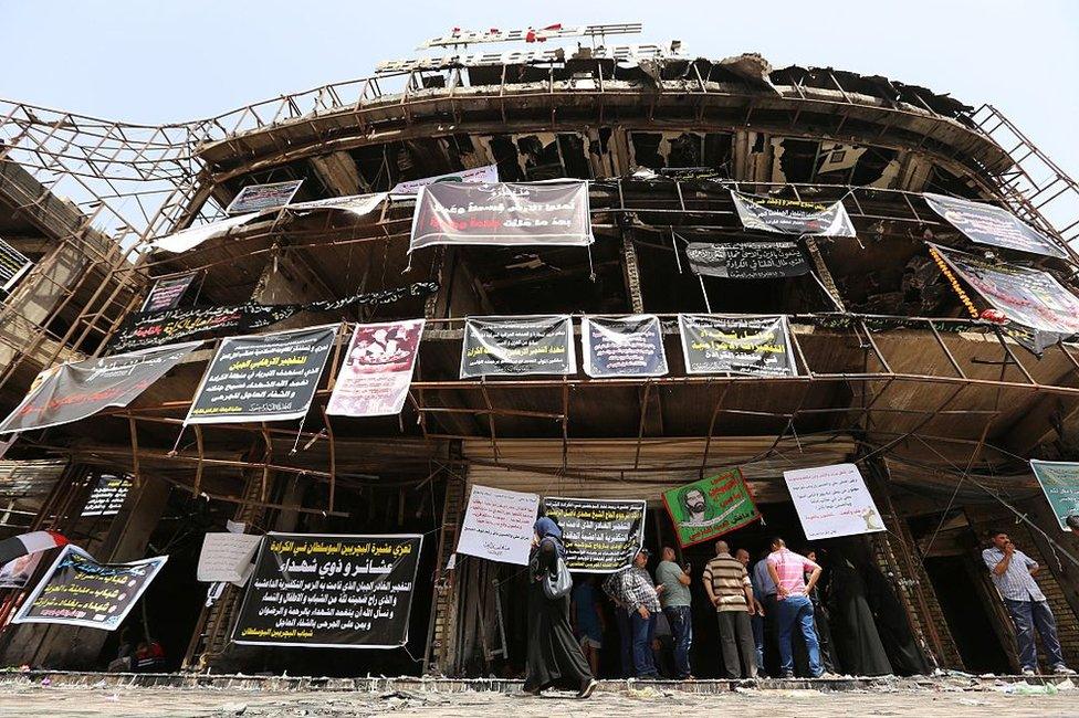 Relatives of victims of the Karrada bombing gather at the site on 5 July 2016