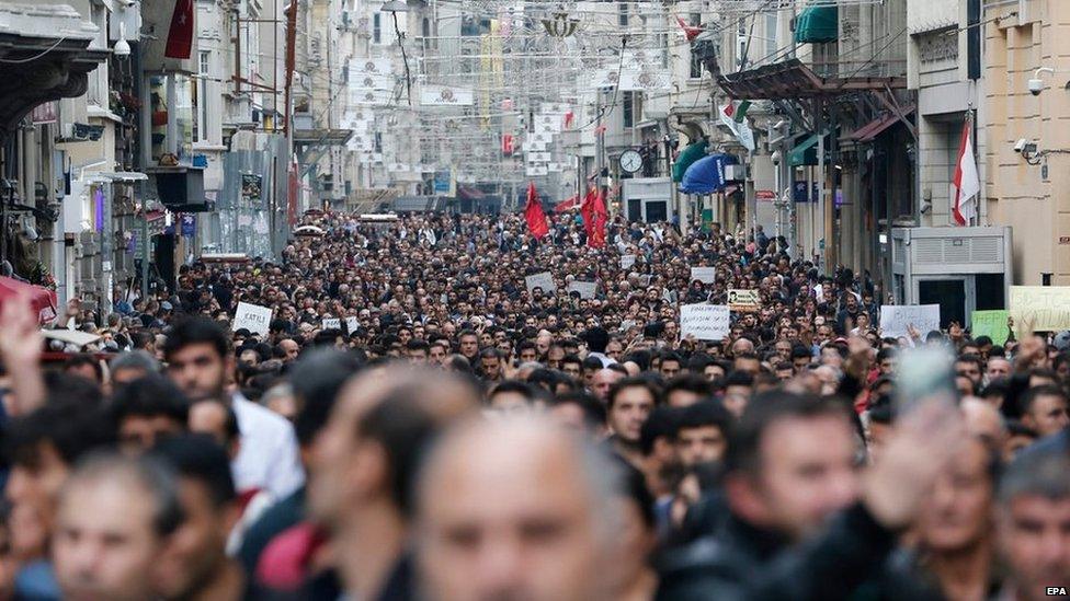 Protestors shout slogans against violence as they gather in reaction to the twin blasts in Ankara, for a rally in Istanbul, Turkey, 1