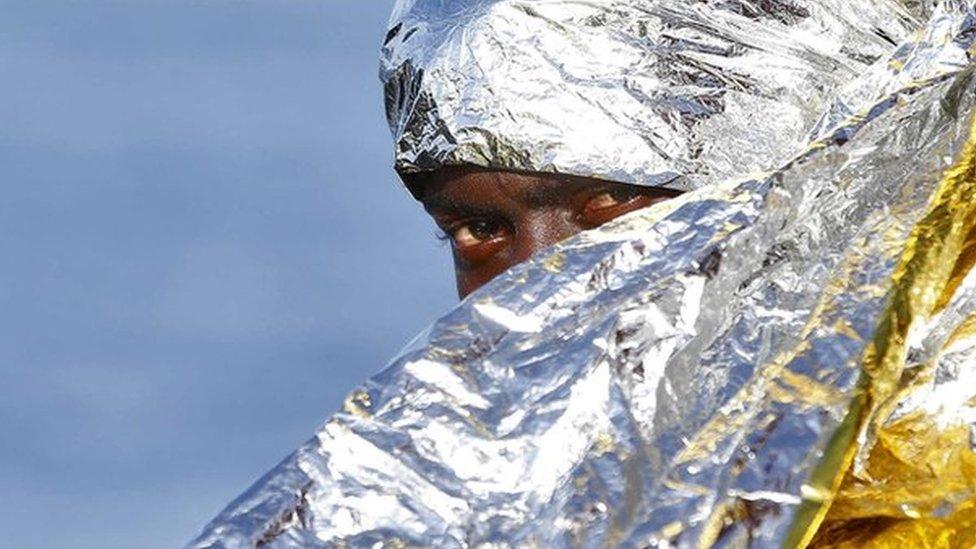 A migrant waits to disembark from the rescue vessel Responder,