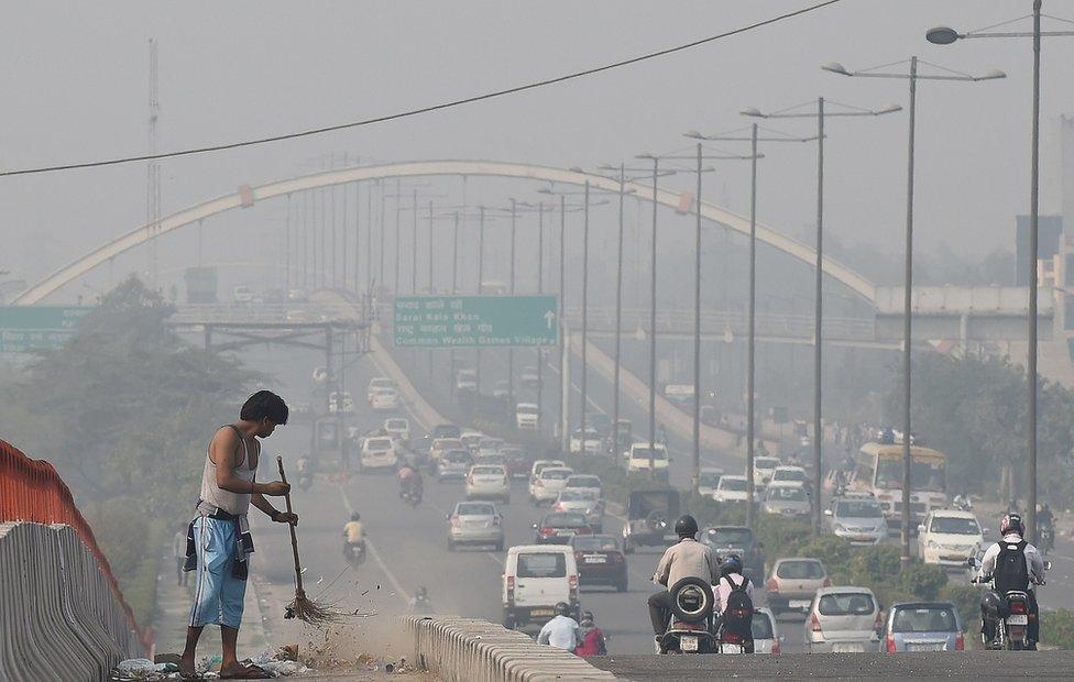 A smoggy view of a main road in Delhi the morning after Diwali celebrations in 2016