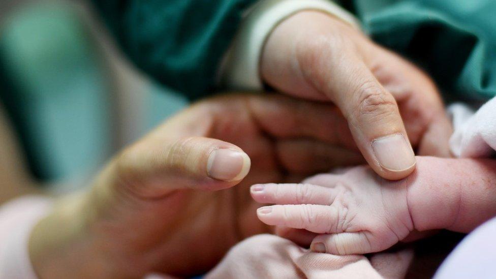 A newborn baby's hand