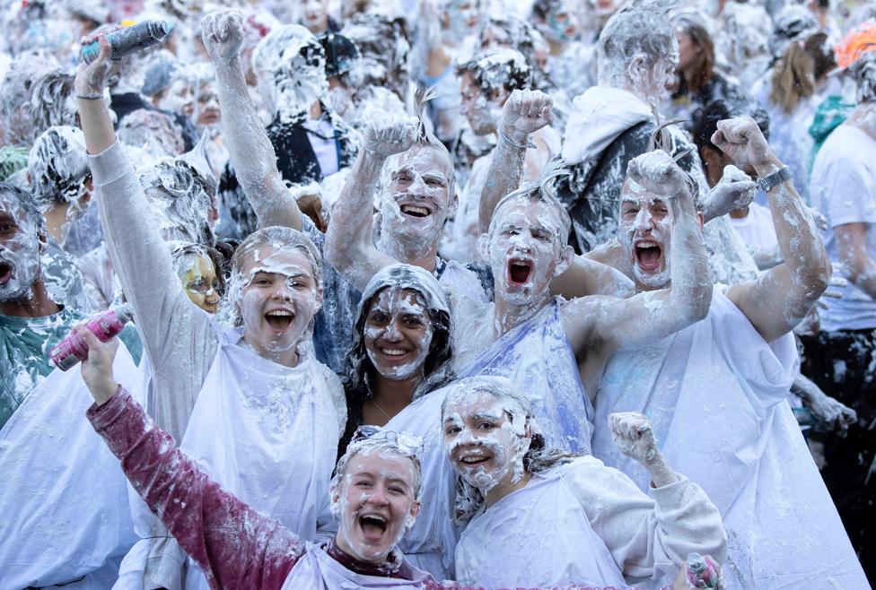 Students pose after taking part in a foam fight