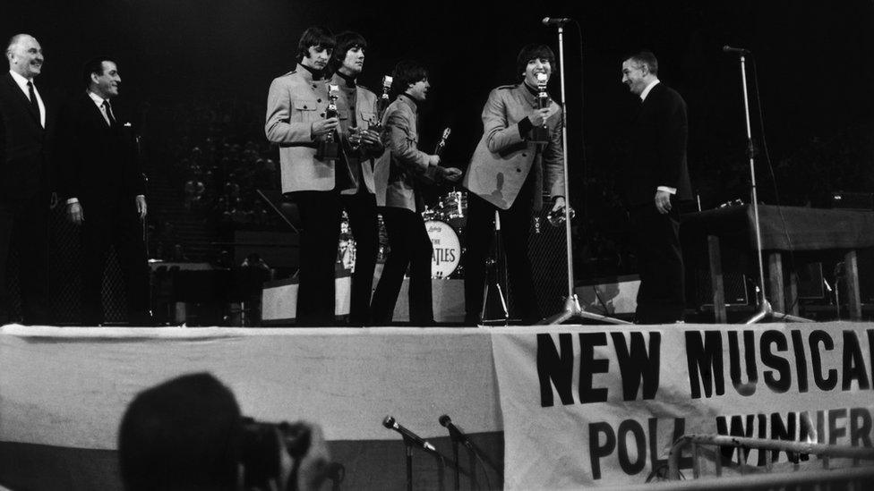 The Beatles receiving awards from Tony Bennett at the NME Poll Winners' Concert in 1965