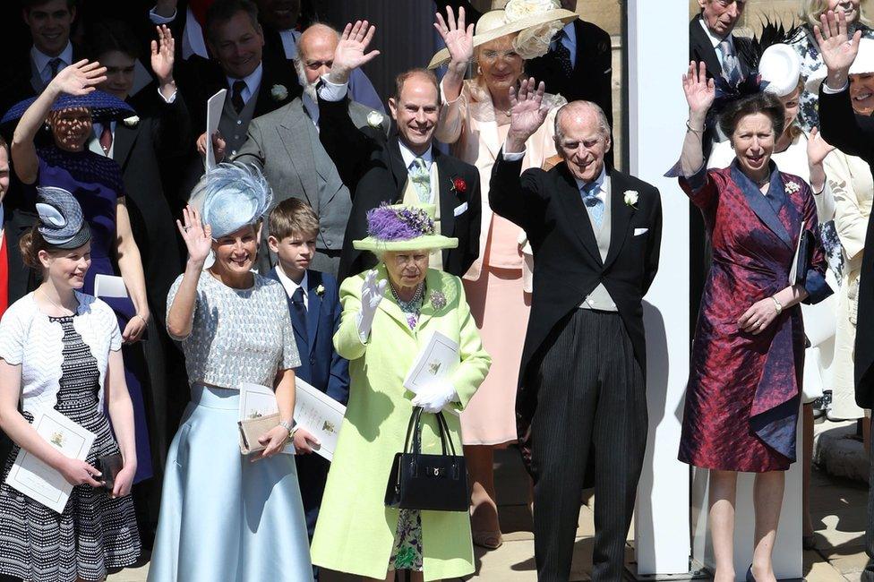 The Queen, Duke of Edinburgh and other members of the Royal Family wave after the wedding