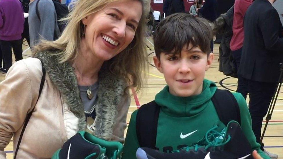 Scobi with his signed pair of trainers