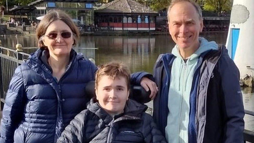 James, with his parents Alun and Janice