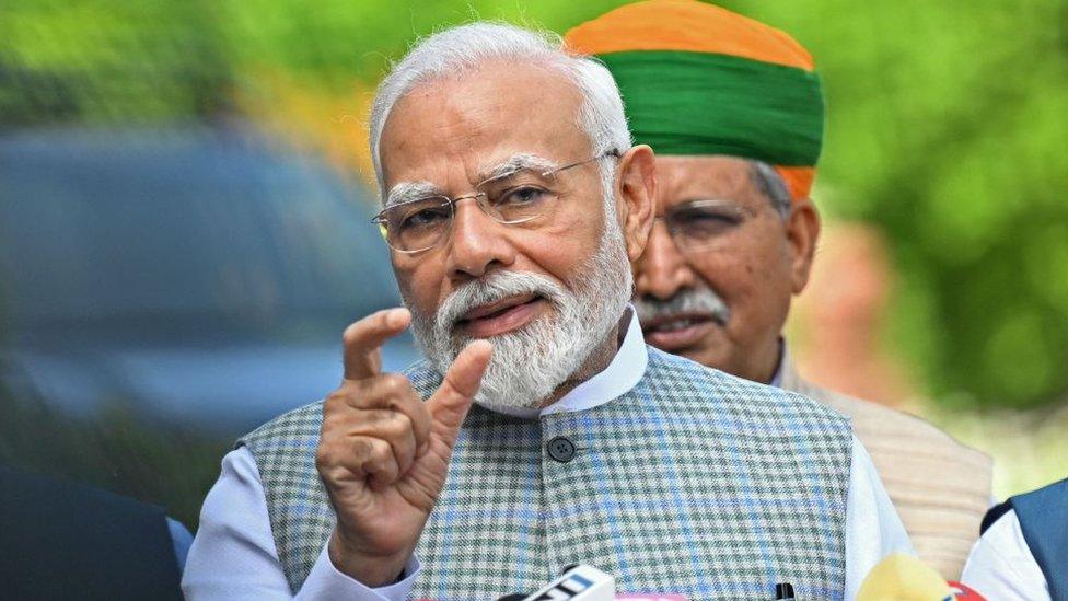 India's Prime Minister Narendra Modi addresses the media representatives upon his arrival to attend the special session of the parliament in New Delhi on September 18, 2023.