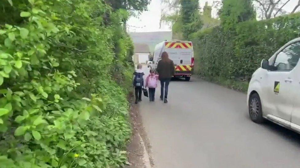 Traffic passing a family