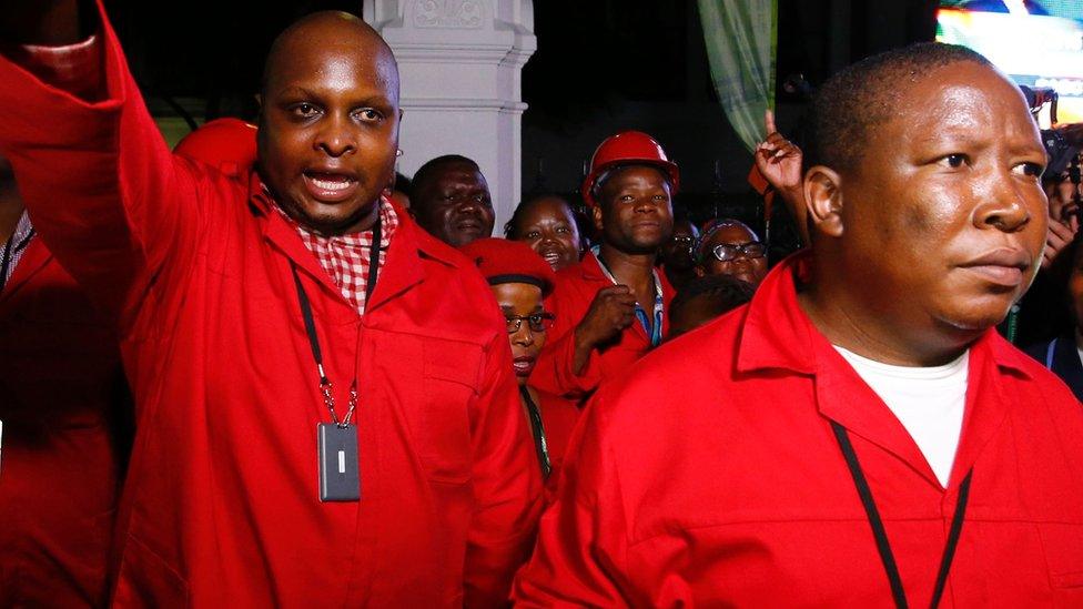 Economic Freedom Fighters (EFF) leaders Floyd Shivambu (L) and Julius Malema (R) leaves parliament after being ordered to do so during President Jacob Zuma's annual State of the Nation Address in Cape Town, February 11, 2016