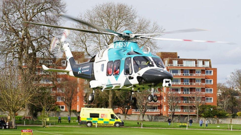 An air ambulance landing at the scene