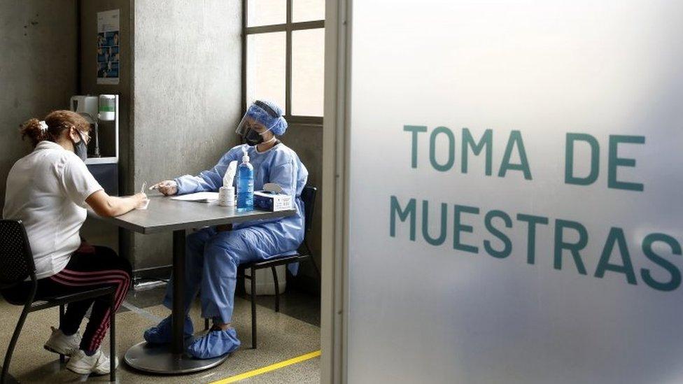 A woman takes a free test for Covid-19, at a metro station in Medellín, Colombia, 08 July 2020.