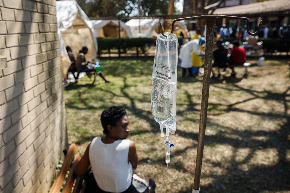 A cholera patient waits for treatment during a visit of Zimbabwe Minister of Health, at the cholera treatment centre of the Beatrice Infectious Diseases Hospital, in Harare, on September 11, 2018.