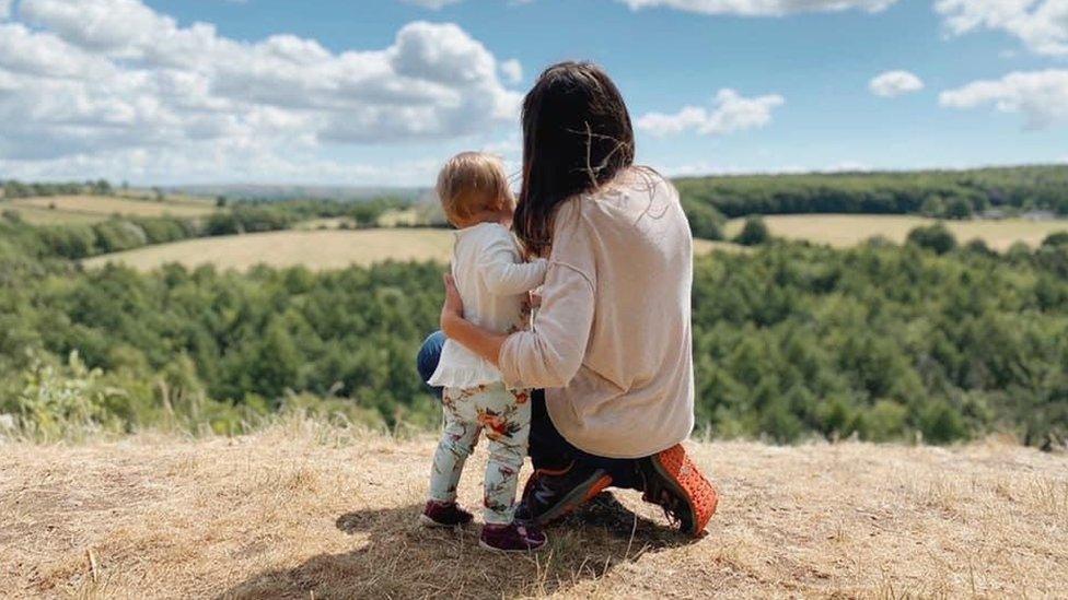 Zia and her daughter from behind