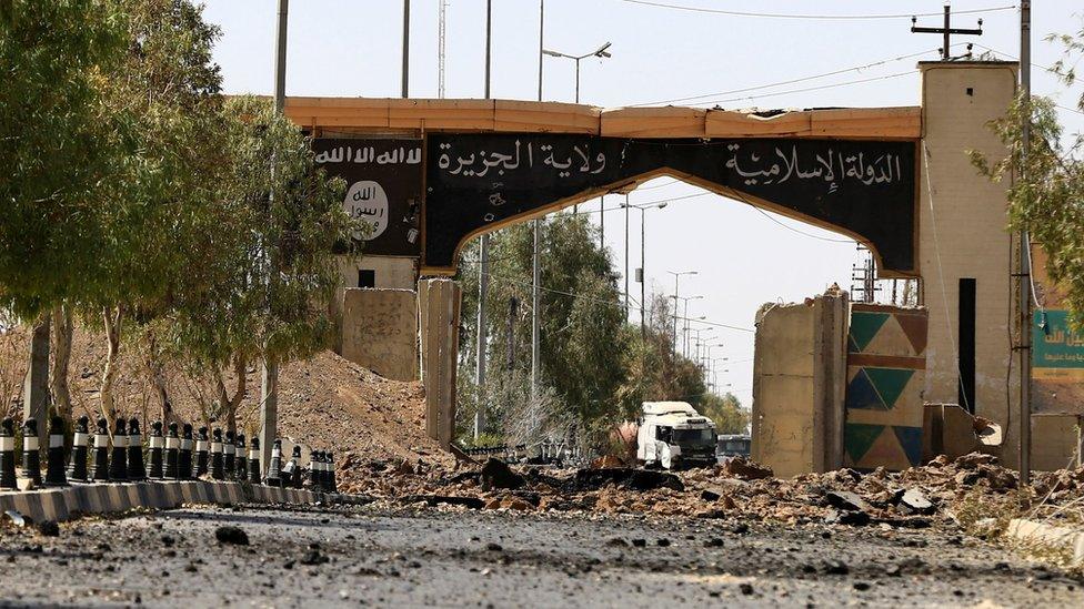 Islamic State banners painted over an entrance to Ayadiya, north-west of Tal Afar, Iraq (28 August 2017)