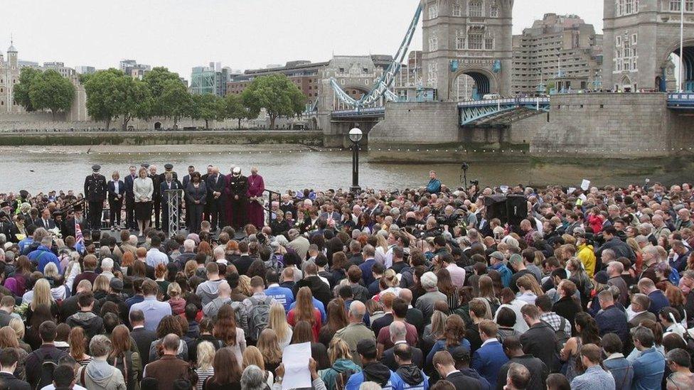 Crowds observe a minute's silence at vigil