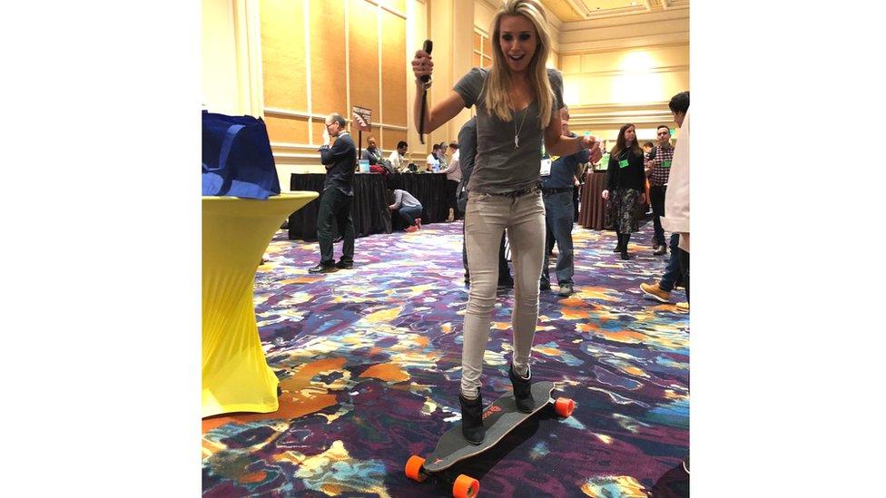 BBC presenter Lara Lewington on an electronic remote control skateboard