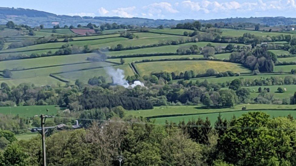 Smoke seen rising over countryside