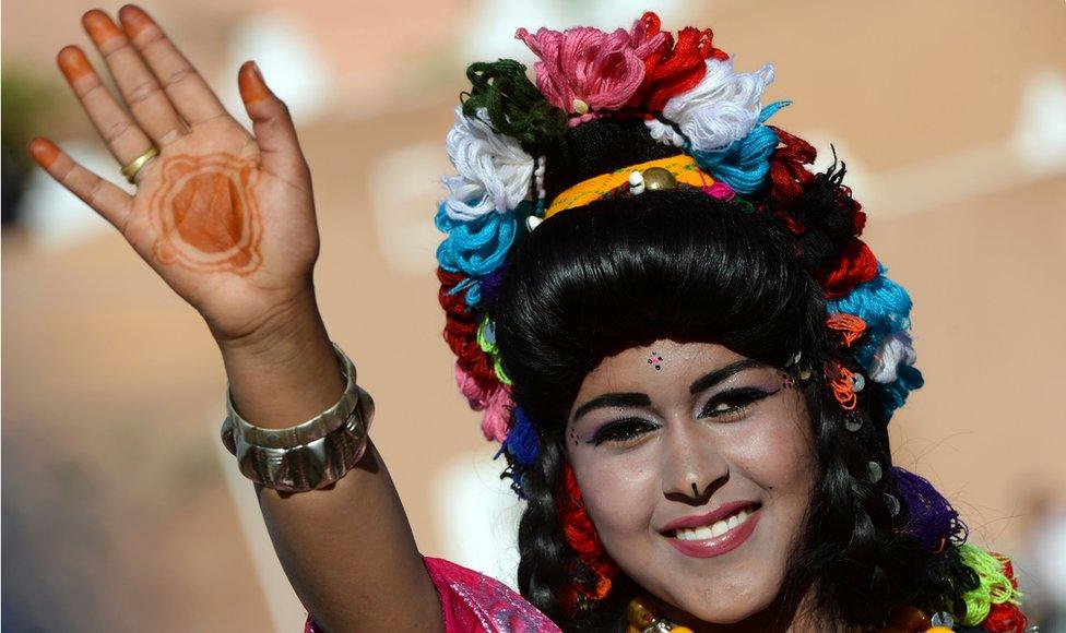 A Berber Moroccan woman, wearing traditional outfits, parades during the "Miss Rose" beauty contest as part of the yearly Rose Festival on May 13, 2016 in the town of Kelaat Mgouna, at the foot of the High Atlas Mountains in Morocco