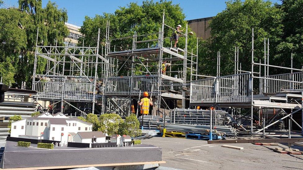 Construction workers building pop-up theatre