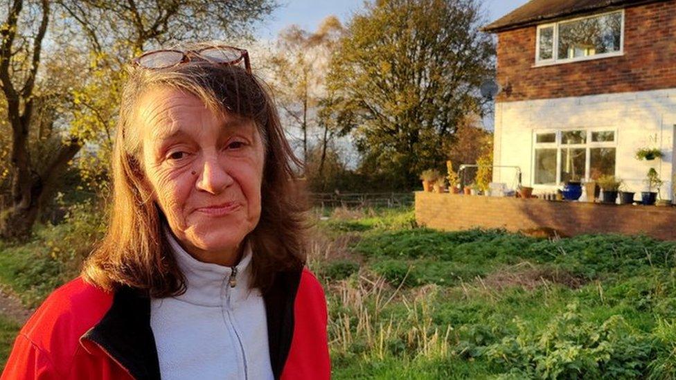 Barbara Smathers standing outside the house she is being evicted from