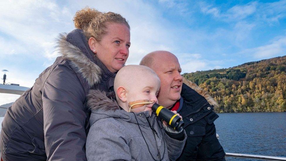 Zachary White and his parents