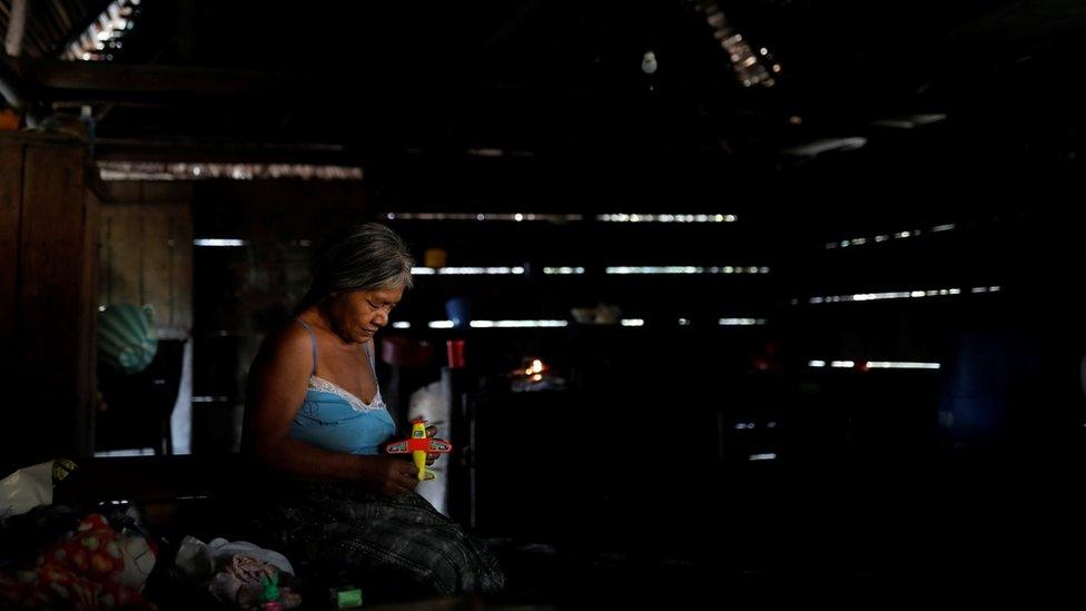 Elvira Choc, grandmother of Jakelin Caal, holds a toy as she waits for the arrival of her granddaughter"s coffin in San Antonio Secortez village, Guatemala, December 22, 2018