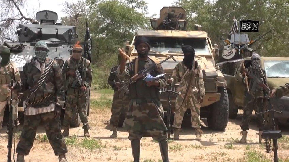 A screengrab taken on 13 July 2014 from a video released by Boko Haram and obtained by AFP shows the leader Abubakar Shekau (C)