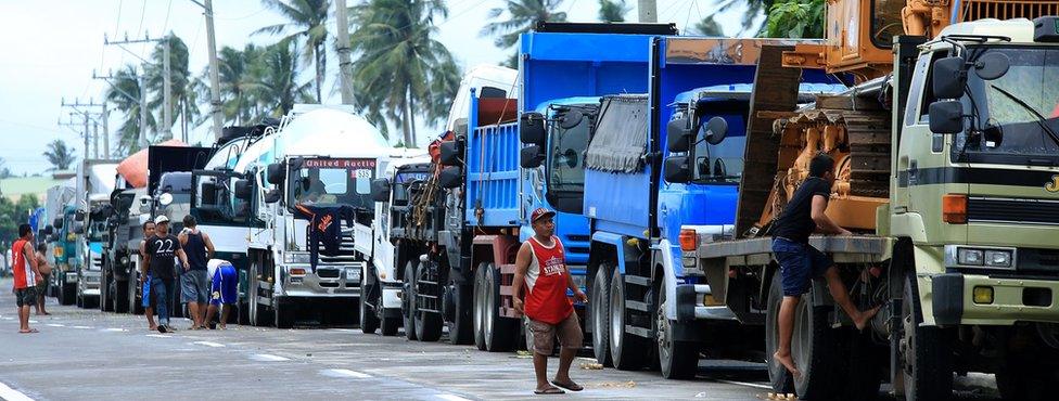 Stranded vehicles sit lined up on a highway heading to the port in Matnog, Sorsogon on 17 December 2017, with disruption caused by Tropical Storm Kai-Tak