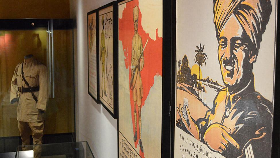 World War One recruitment posters and a WW1 uniform in Manchester Museum's South Asia gallery