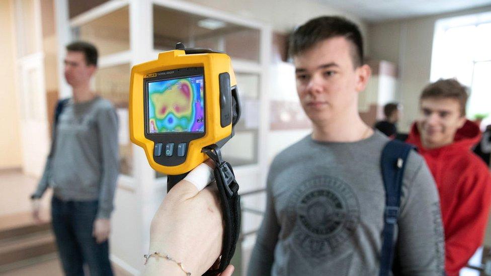 Checking students' body temperature with thermal imaging cameras at the entrance to Ryazan State Radio Engineering University during the COVID-19 coronavirus pandemic.