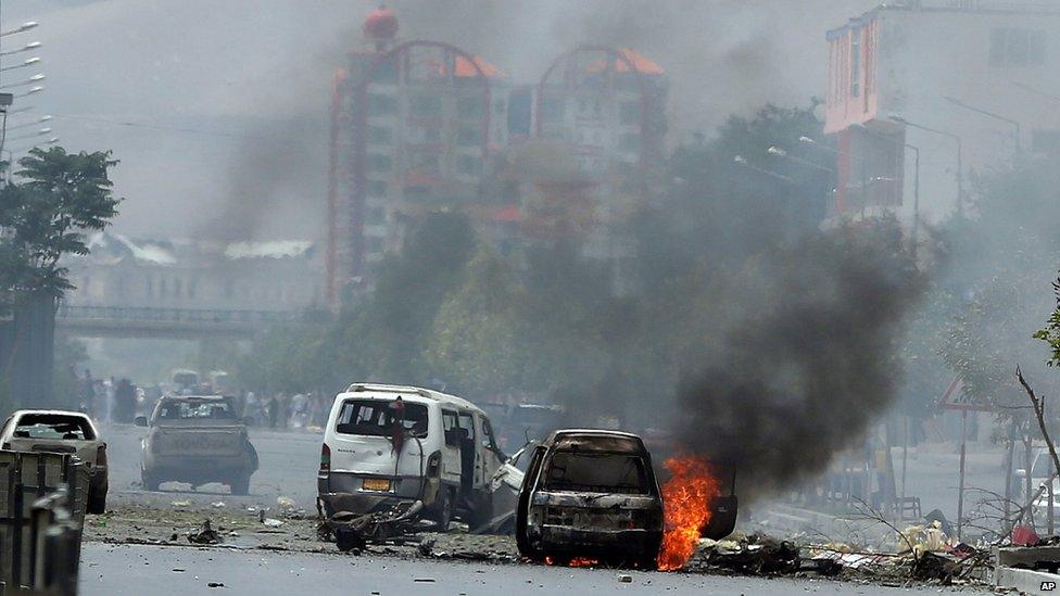 Fire and smokes rise at the site of a suicide attack during clashes with Taliban fighters in front of the Parliament, in Kabul, Afghanistan, Monday, June 22, 2015