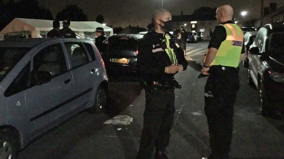 Police officers during an operation to crack down on illegal social gatherings