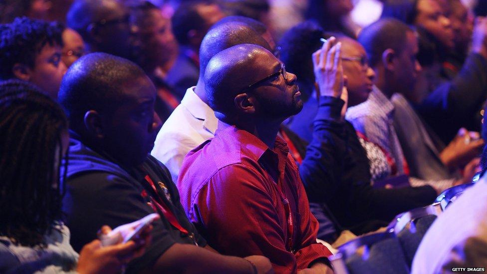 Attendees listen to Hillary Clinton talk at the Urban League's annual meeting 31 July 2015