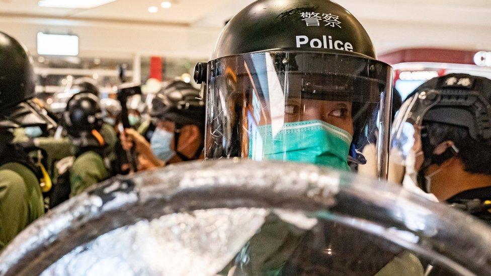 Riot police secure an area inside a shopping mall during a rally on July 21, 2020 in Hong Kong, China